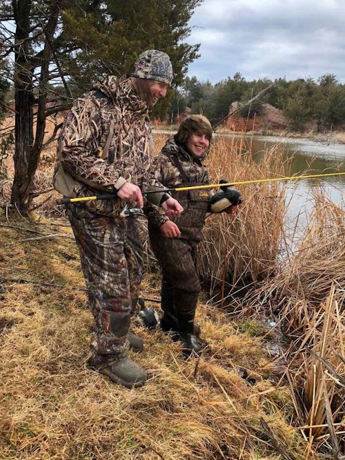 Guide Dylan Chabino (right) shows the author how to retrieve deep-water decoys with a fishing rod rigged with a treble hook.