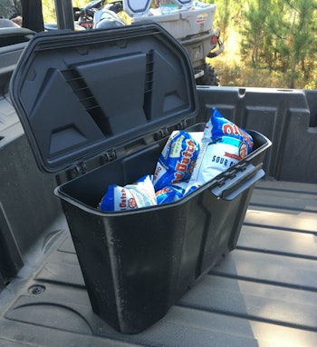 Shown above is the removable sealed/waterproof storage compartment that’s hidden beneath the passenger seat. In the photo below you can see the roof rack that carried our gear away from splashing water and mud.