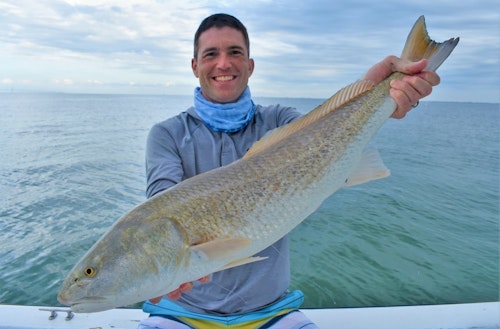 The author with a 32-inch redfish caught during an afternoon with guide David White of Anna Maria Charters.