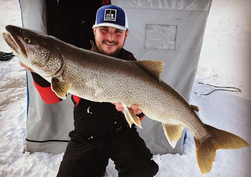 Jordan Korzenowski of FishNorthMN with a winter-caught Lake Superior lake trout. When safe ice forms on Superior, he'll take a limited number of clients who dream of fighting big fish on frozen water.