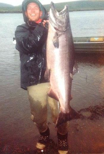 This old print image of the author from 1992 is of poor quality, but it illustrates an important point: Big fish don't need to be held out to look big. This Alaska king salmon weighed 62 pounds, and seeing it draped across the author's body helps tell the tale. He would have held the fish horizontally if he'd planned on releasing it, but this one was kept for the grill.
