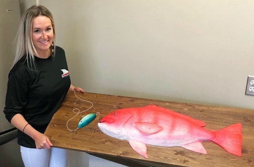 Dusty Sinclair with another fun cake creation, a 32-inch red snapper groom’s cake. Sinclair's business is located in Corpus Christi, but she travels throughout Texas for weddings.