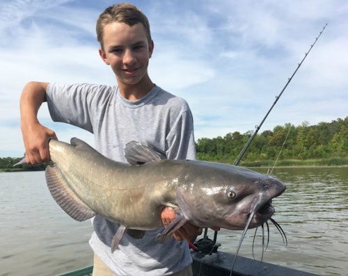 Elliott takes his turn landing and releasing a 20-plus-pound Red River channel cat.