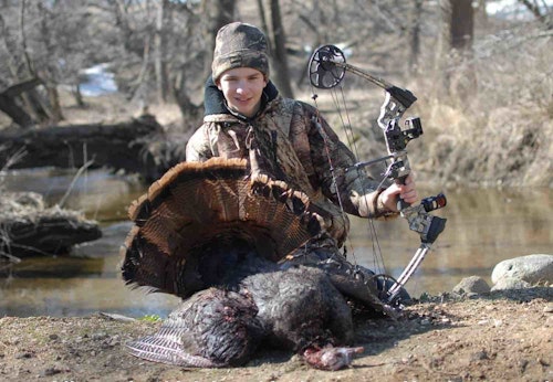 The author’s oldest son Elliott with his first archery turkey, killed a few years ago. He shot the jake at close-range with a 35-pound-draw Mission compound and 125-grain Magnus Bullhead broadhead.