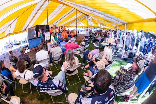 Crowds of anglers and families gather on the beach at Cragun’s to view the results of the fishing tournament and hear testimonies of people impacted by Minnesota Adult & Teen Challenge.