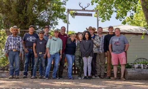 Hunters, guides and hosts gather for a group photo.