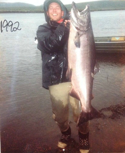 The author with a 63-pound king salmon from Alaska’s Togiak River. This fish was stunned and then bled before transporting it in the john boat.
