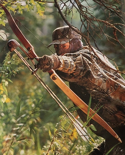 If you’re thinking of trying traditional archery, don’t make the same mistake as the author (above) and shoot too much weight. Here, he’s struggling to hold 70-pound-draw limbs on his custom recurve for a quick photo.