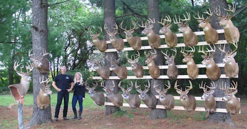 Jeff Helmers and his daughter Catie with bucks killed on their 41-acre Wisconsin property.