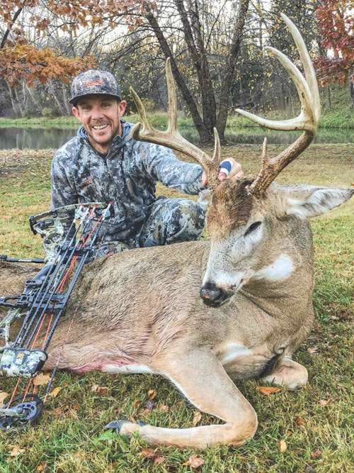 The author poses with his redemption buck — a 200-plus pound Cornhusker brute, sporting a heavy 4x4 rack.