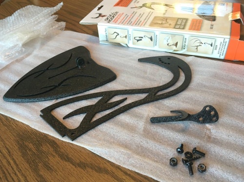 Table Hooker components include (left to right) the base, arm and prong. All required screws and nuts are included.