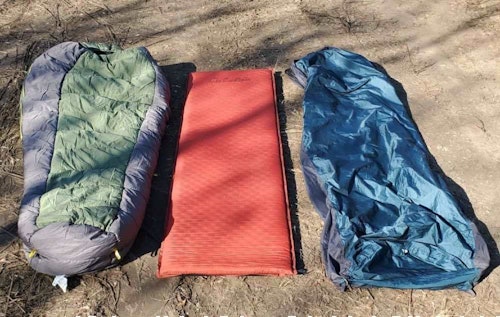 This is my sleep system for these overnights. Left to right: warm sleeping bag, insulated pad, bivy sack. I carry these in a Cabela’s Boundary Waters pack. Then I put all my clothing in the pack at night to stay dry and contain odors. I can also stand on the pack when dressing.