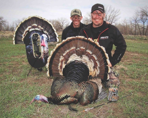 The author (left) and his hunting buddy, Danny Farris, with mature tom fooled with a Stalker Turkey Decoy from Ultimate Predator Gear.