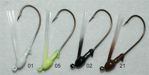 The author’s favorite deep weedline lure is a J-Mac Finesse Jig (above) matched with a 5-inch YUM Dinger (below). This jig slips through vegetation thanks to the bullet-shaped head and fiber weedguard. In clear water, the author chooses a Green Pumpkin Dinger; in darker water, he prefers Black/Blue Flake.