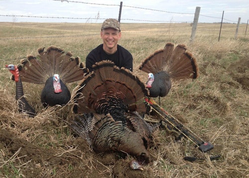 The author removed a dark-colored face mask for this photo. On the prairie, he dresses in a black long-sleeve t-shirt or jacket (and dark face mask) to look like another strutting turkey. 