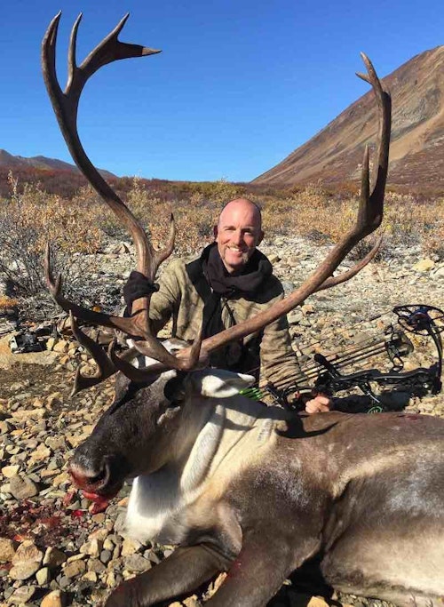 In preparation for his many big game hunts throughout North America, John Schaffer, shown here with a caribou, regularly hikes and lifts weights in his home state of Minnesota.
