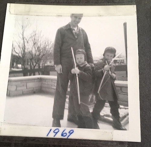 The author (center) at four years old in 1969, ready to go huntin’ with his bow at a nearby park with his dad and brother.