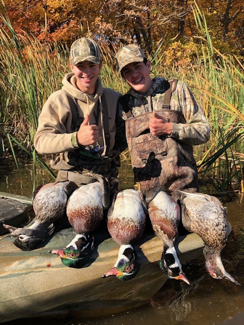 As air and water temps begin to cool during fall, you can add layering garments beneath breathable waders for added warmth. Here, Elliott Maas (left) wore breathable waders with fleece pants while his buddy, a new hunter who shot his first drake mallards on this morning, wore neoprene waders to stay warm and dry.