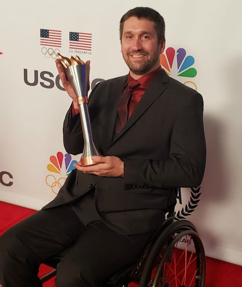 Ben Thompson with his award for 2019 Male Paralympic Athlete of the Year.