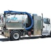 Compact, truck-mounted excavator can dig with air or water