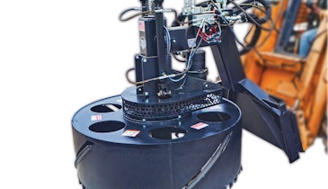 Skid-steer attachment makes manhole replacement easy