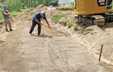 Steep Maine Hillside Requires Carving a Flat Drainfield Bed