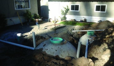 Portable septic tank installed on tight site